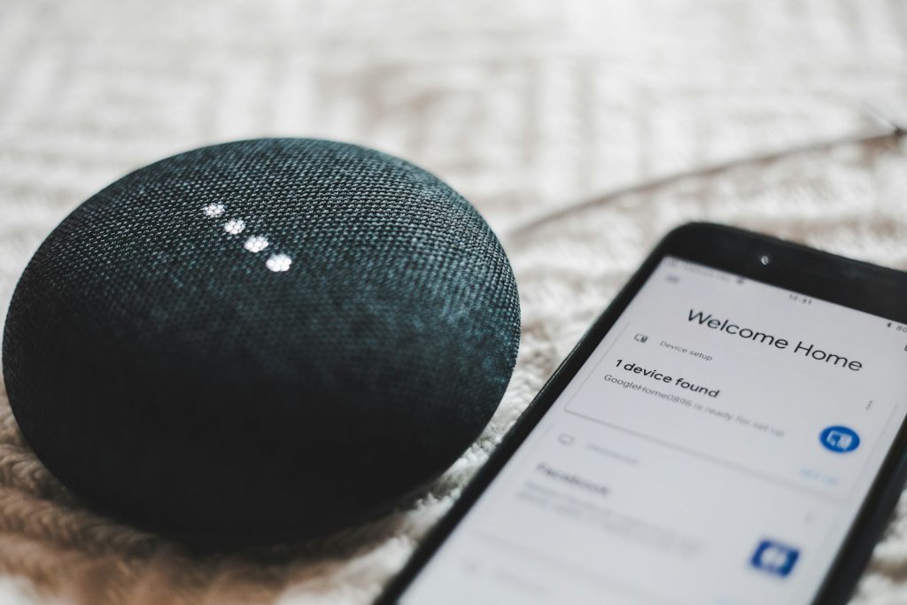 Smart speaker and smartphone app controlling home devices