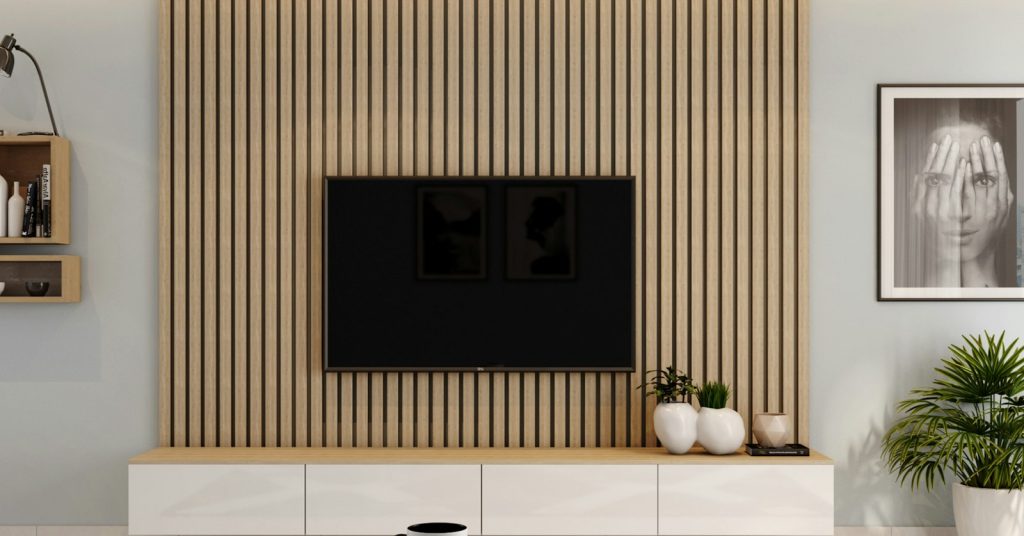Flat screen TV mounted on a slatted feature wall